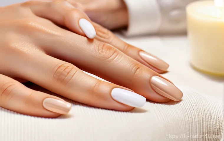 핸드와 풋 케어 겸용 크림 추천 - **Prompt:** A close-up shot capturing the essence of pampered, soft hands. One elegant, gender-neutr...