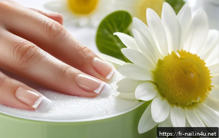 네일 클리너와 리무버 차이 - A close-up, high-resolution image of a well-manicured hand with natural nails being gently cleaned u...